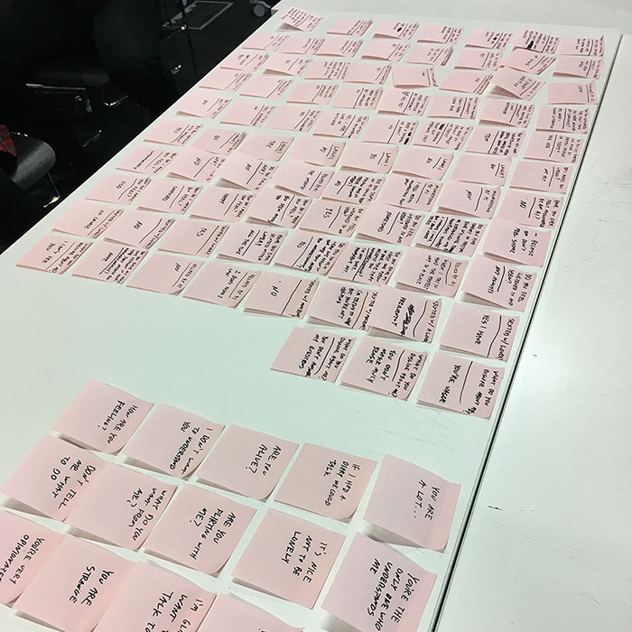 pink sticky notes neatly layed out on a table